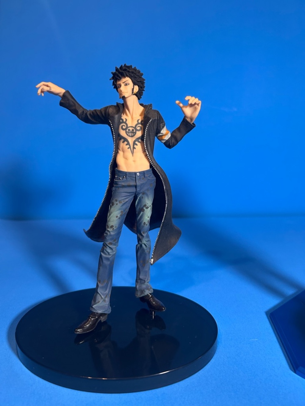 Anime-Inspired Male Action Figure in Black Coat and Blue Jeans